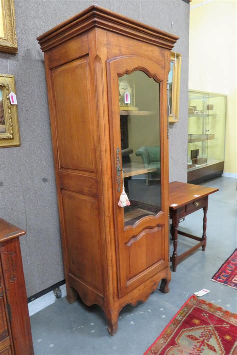 French provincial style kitchen cabinets. Lot - French Provincial style walnut cabinet