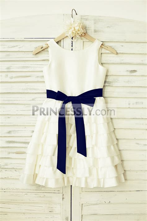 The top is made of satin with the lace applique on. Ivory Taffeta Cupcake Wedding Flower Girl Dress with Navy ...