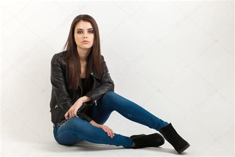 Portrait Of Sitting Young Calm Beautiful Brunette Woman Posing For