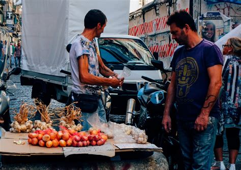 Fried panzerotti filled with anchovies and capers, naples beautiful streets and courtyards of naples, historical sites and sculptures of the city. La Pignasecca Market in Naples: Street Food in Napoli - An ...