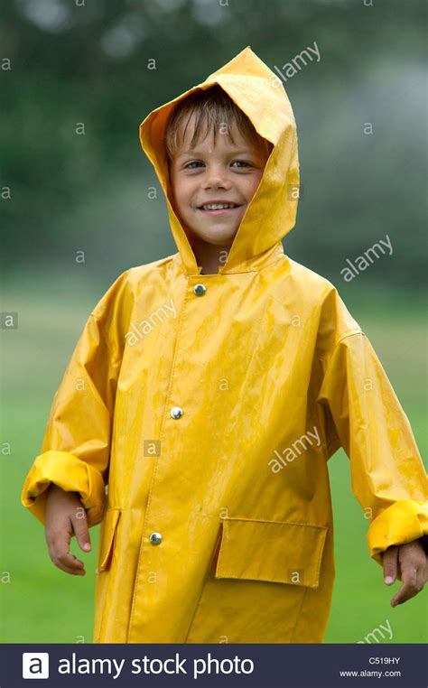 Many contemporary brands provide a lovely selection of yellow raincoats for women. portrait of young boy wearing yellow raincoat Stock Photo ...
