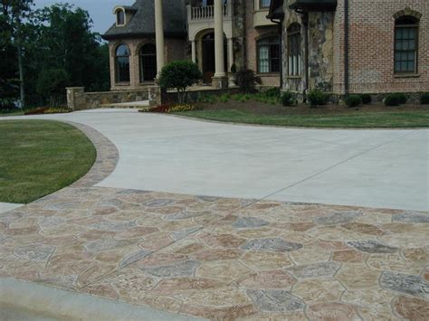 The previous owners of my house installed a concrete sidewalk all along the foundation at back of the house. Driveway Improvement Ideas | HGTV