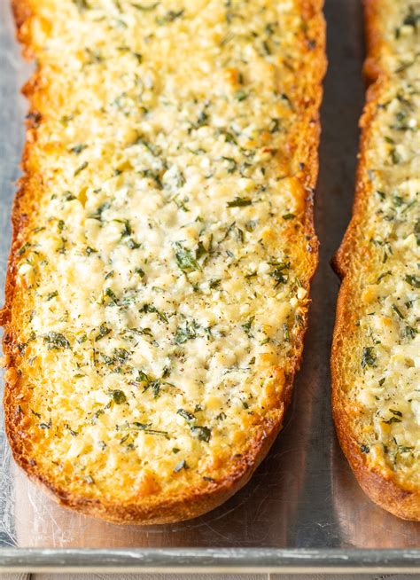 Slice the italian loaf lengthwise and heavily smear half of the butter mixture on each of the halves. How To Make Garlic Bread Spread From Scratch - Bread Poster