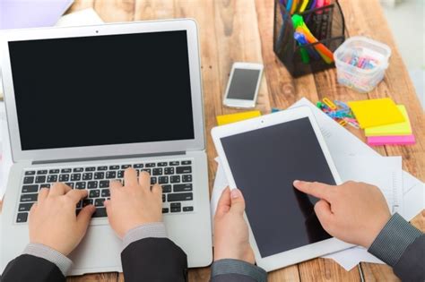 Free Photo Business People With A Laptop And A Tablet Seen From Above