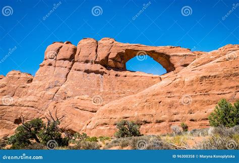 Stone Sandstone Cliffs And Natural Arches In The Arches National Park