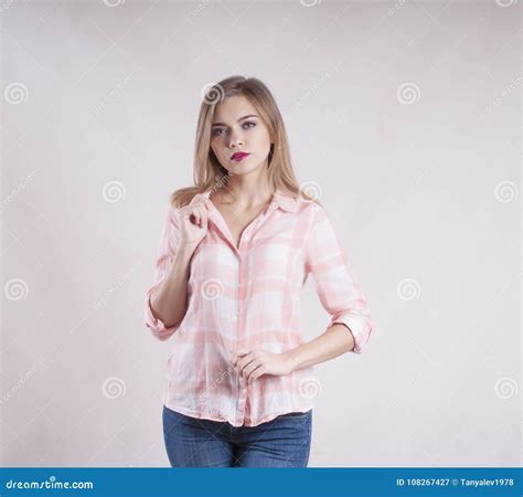 Beautiful Girl In Jeans And A Serious Shirt Stock Image Image Of