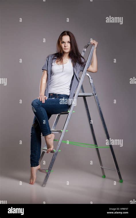 Young Woman On Step Ladder Stock Photo Alamy