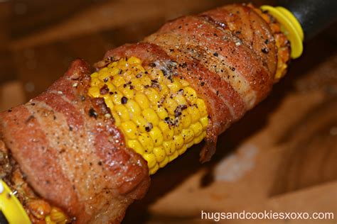 Husked ears of corn are coated in a paste made with mayonnaise, parmesan cheese, chili powder, parsley, and black pepper before being wrapped in aluminum foil and roasted in the oven for a new way to prepare everyone's favorite summertime barbeque side item. Bacon Roasted Corn - Hugs and Cookies XOXO