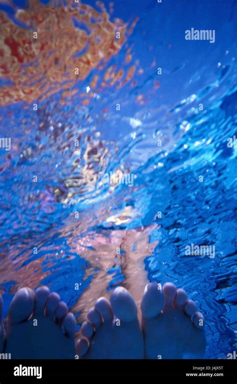 underwater recording women detail soles water surface under water swimming pool pool