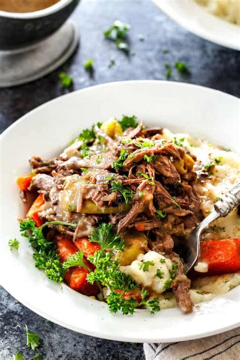 If you love pot roast as much as i do you are in for a beige treat. up close of crock pot Mississippi Pot Roast on a plate ...