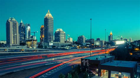 Download Aesthetic Atlanta Skyline With Trail Lights Wallpaper