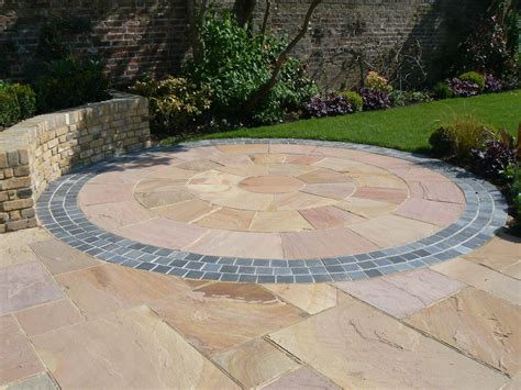 This Pink Sandstone Circle Creates The Perfect Transition Between Patio