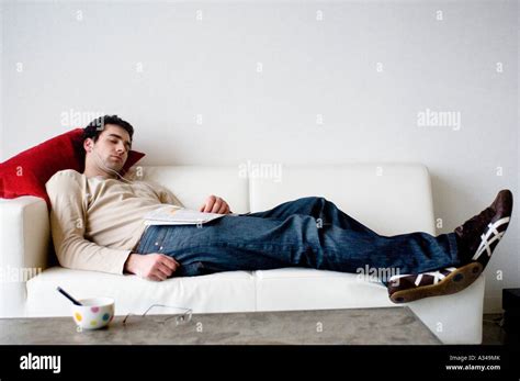 Man Sleeping On A Sofa Stock Photo Alamy
