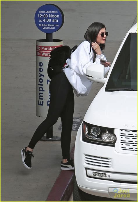 kylie jenner gets a big kiss from tyga at the airport photo 994503 photo gallery just