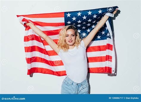 American Blonde Woman Holding The Usa Flag Isolated Over A White Background Stock Image Image