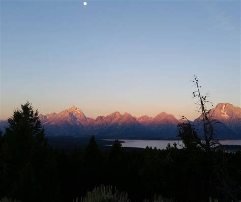 Sunrise On The Tetons As The Moon Sets At Grand Teton National Park