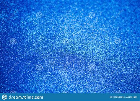 Blurry Shimmering Background Of Blue Sequins Silver Glitter Light