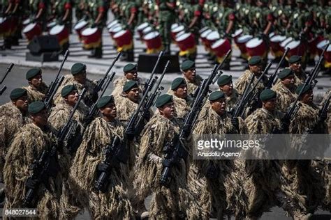 Camouflaged Snipers March During The Annual Military Parade At Zocalo