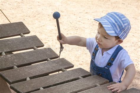 Baby Boy Playing Wooden Xylophone At Playground Stock Photo Image Of
