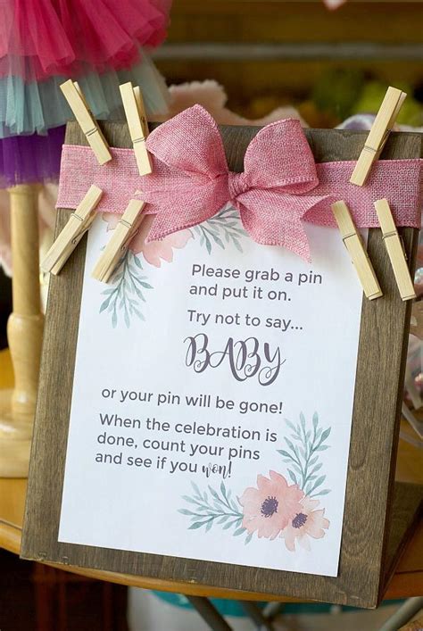 Guests write cute or motivational sayings on diapers. Baby Shower Game Printable | Clothes Pin Baby Game ...