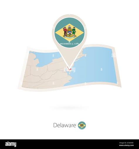 Folded Paper Map Of Delaware Us State With Flag Pin Of Delaware