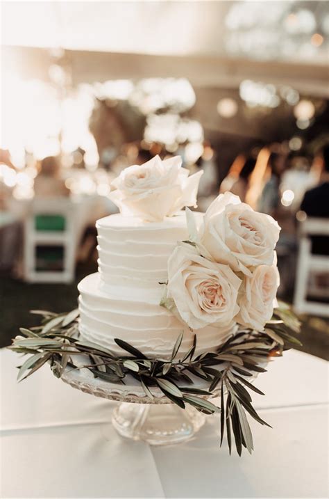 Classic buttercream with a twist wedding cake. Two Tier Round Buttercream Wedding Cake with White Roses ...