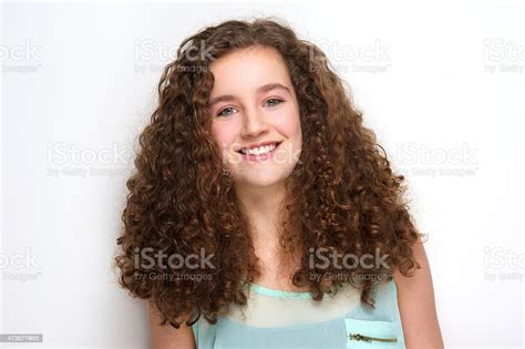 Beautiful Teenage Girl With Curly Hair Posing On White Background Stock