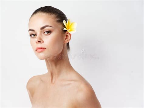 Romantic Woman With Yellow Flower In Hair Naked Shoulders Clear Skin