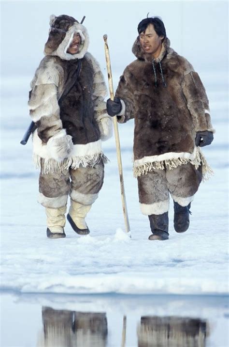 Inuit Men In Traditional Dress On The Ice In Nunavut Territory Canada