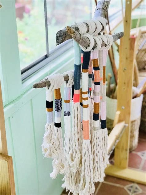 Maybe you would like to learn more about one of these? Bohemian yarn wrapped tassel wallhanging | Etsy in 2020 ...