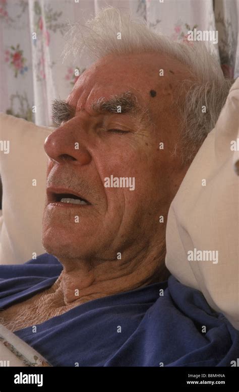 Old Man Lying In Bed Asleep With Mouth Open Stock Photo Alamy