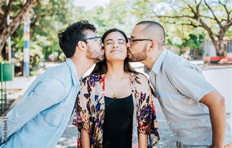 Love Triangle Concept Polygamy Concept Two Men Kissing A Girl Cheek