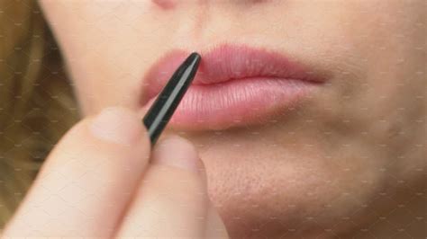 Super Close Up Slow Motion 4k A Woman Paints Her Lips With A Pencil