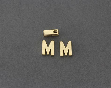 There are 26 letters in the alphabet:: Uppercase Alphabet M Brass Bead . Letters & Numbers ...