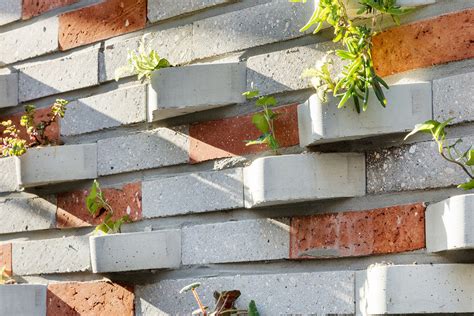 Creative Brick Design With A Built In Planter Turns The Outer Facade Of