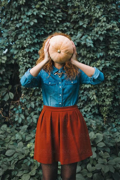 Woman Holding Pumpkin In Front Of Her Face Del Colaborador De Stocksy Danil Nevsky Stocksy