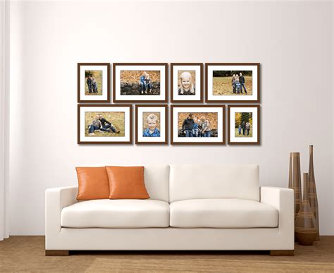 Creating a wall collage of pictures is an easy and fun way to take up that empty space on a large wall, making any room feel fully inhabited. Large Living Room Wall Gallery - Jenn Di Spirito Photography