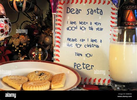 Dear Santa Letter With Milk And Cookies Under Christmas Tree Stock