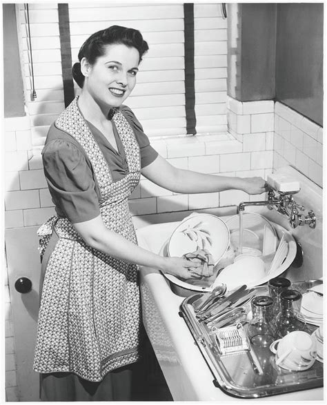 Woman Washing Dishes In Kitchen Sink Photograph By George Marks Fine