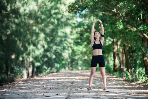 Young Fitness Woman Stretching Legs Before Run 3094584 Stock Photo At