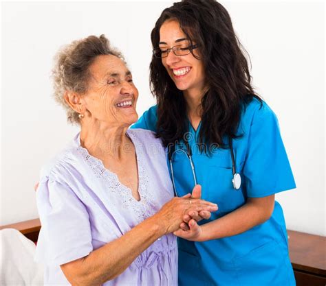 Nurses Caring For Elderly Patients Stock Photo Image Of Happiness