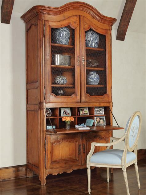 Fit a computer desk with hutch into existing decor to make it easy for you to blend items with the current office try a classic wood piece for a home office in a traditional study lined with vintage bookcases. Photo Page | HGTV