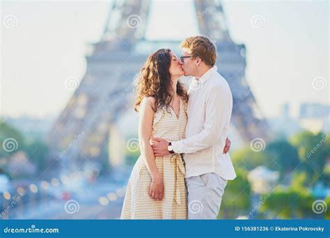 Happy Romantic Couple In Paris Near The Eiffel Tower Stock Photo