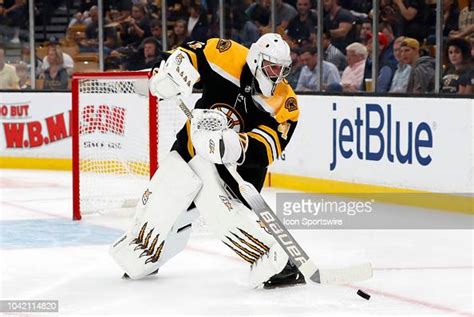 Boston Bruins Goalie Jaroslav Halak Plays The Puck During A Preseason