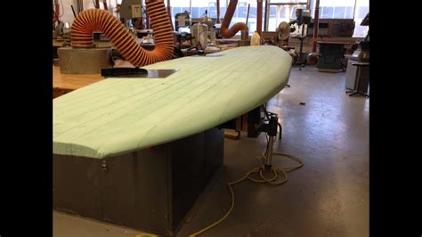 Open up another tube of adhesive and spread it on top of the foam paddle board keel. SUP board timelapse foam shaping - YouTube