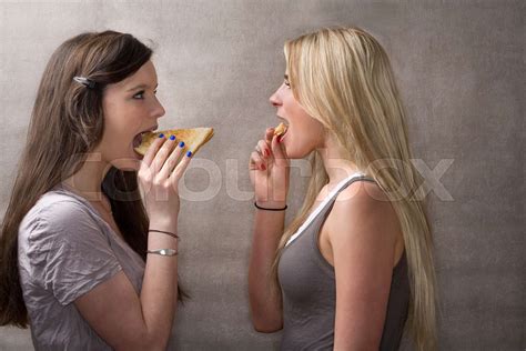 teen girls eat sandwiches stock image colourbox