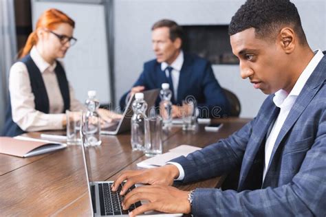 Concentrated African American Businessman Typing On Stock Image Image
