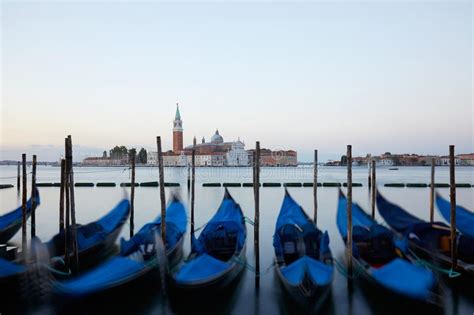 Gondolas And San Giorgio Maggiore Basilica In Venice Italy Stock Image