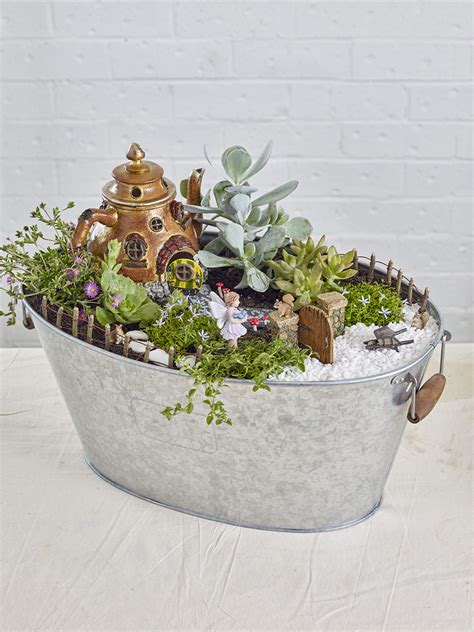 Looking for garden ideas that will surprise your kids? Kids Garden Idea: Create a mini DIY teapot cottage garden ...