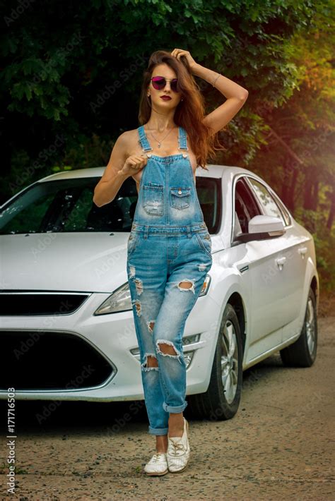 Handsome Young Lady With Big Silicon Boobs Wears A Jeans Overall On
